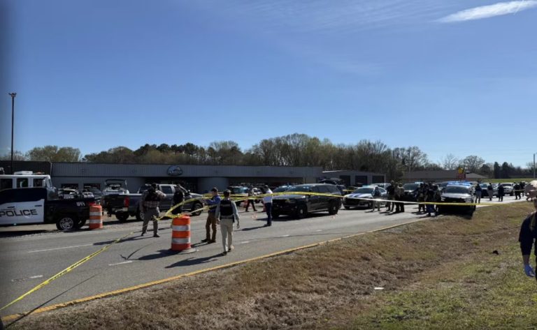 Shocking Shootout: Officer and Bystander Wounded in Bank Heist!