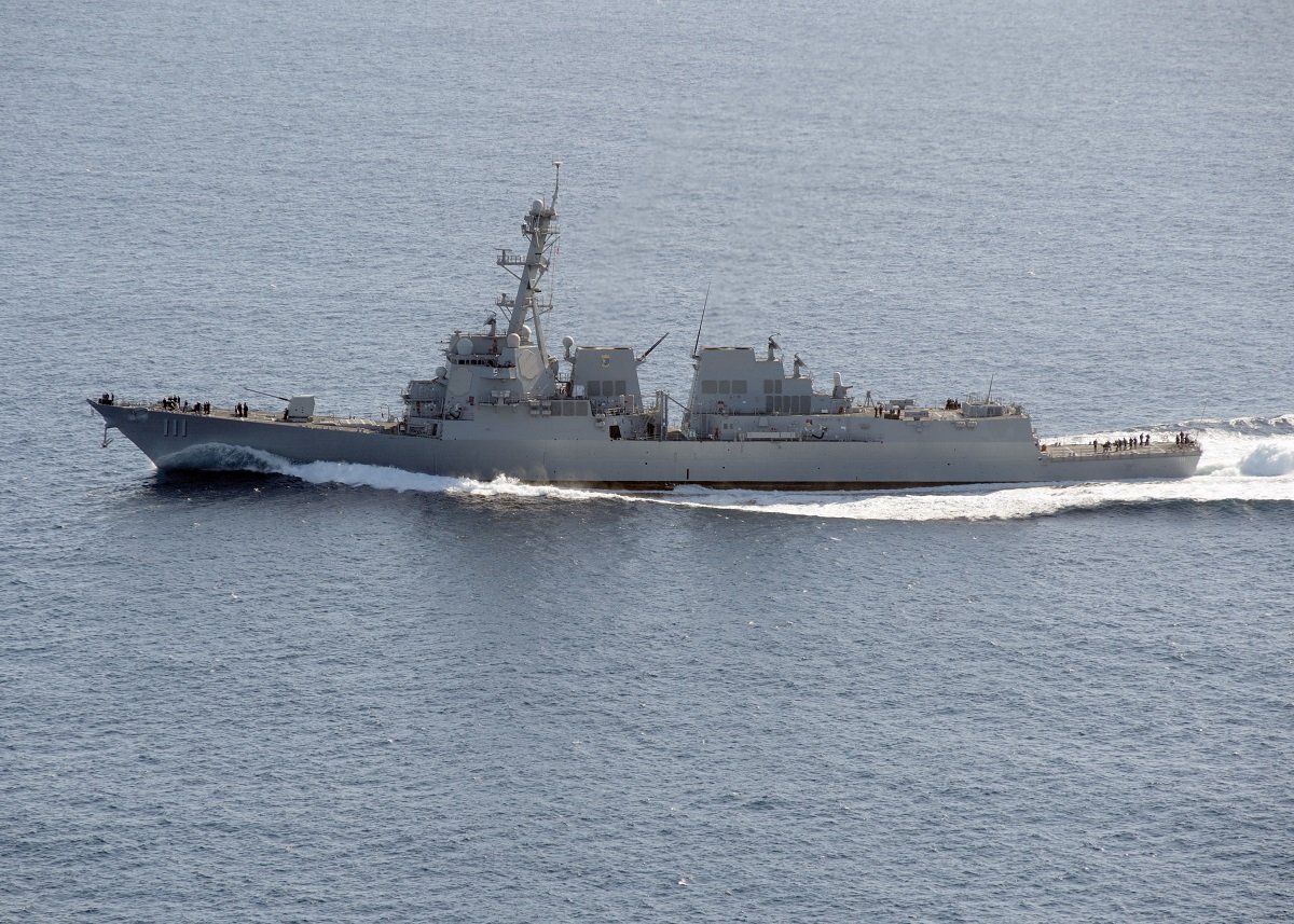 USS Spruance's Bold Move: Suspect Vessel Apprehended at Sea!