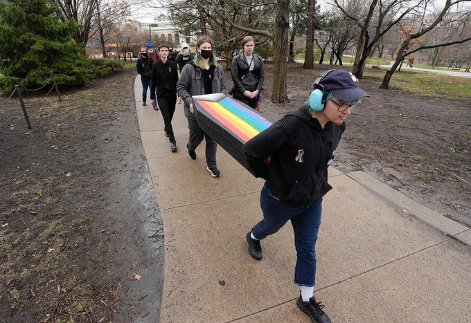 Iowa State Students Hold 'Funeral' for Closing LGBTQ Center!  
Pride Casket Sparks Outrage: Is This Comedy or Insensitivity?