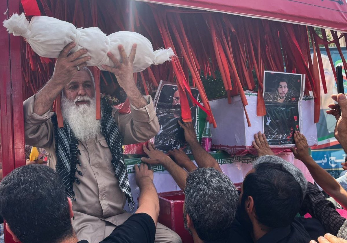 Outrage as Elderly Man Cradles Infant Victim of Israeli Airstrike