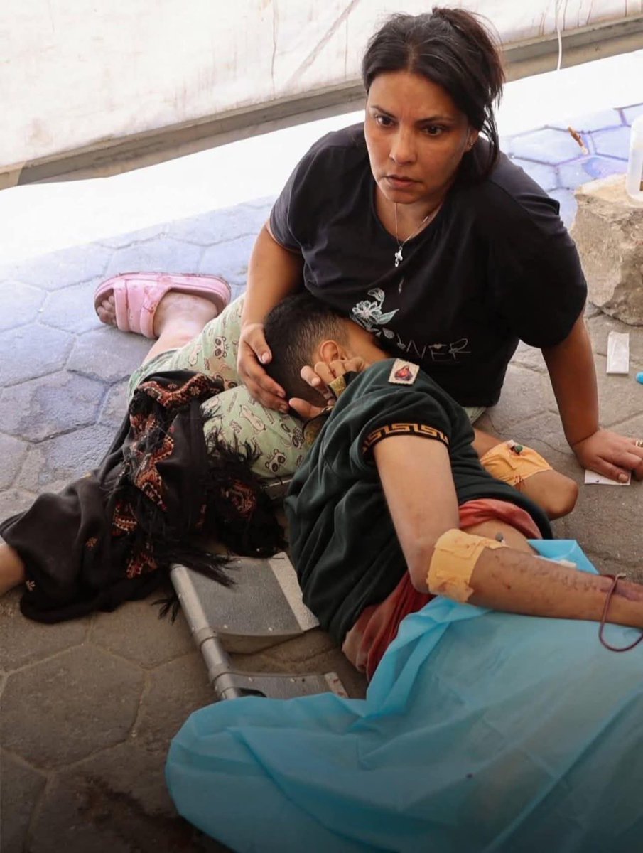 Mother's Heartbreak: Church Bombing Sparks Outrage! —  grieving mother Gaza conflict, Latin Patriarchate bombing news, Suhail Abu Dawoud injury updates