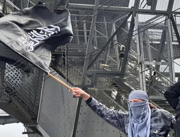 Convicted ISIS Recruiter Waves Flag at Sydney Rally! —  ISIS flag Sydney rally, convicted terrorist recruiter Australia, Gaza conflict protests 2025