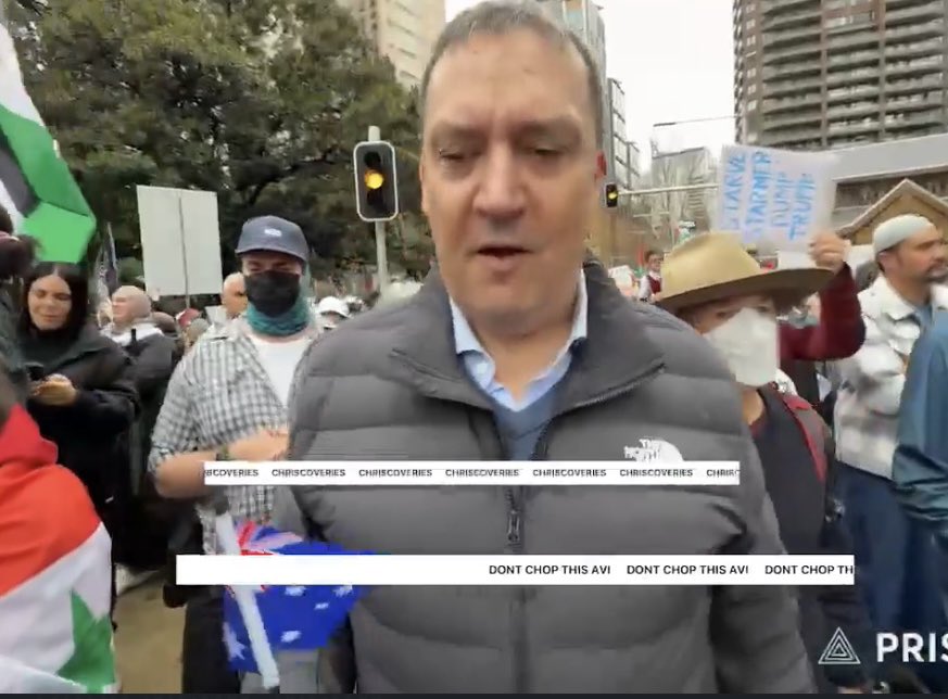 John Ruddick Sparks Outrage with Aussie Flag at Rally! —  Aussie flag rally Sydney, Palestinian rights protest 2025, Aboriginal flag significance