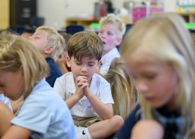 Texas Senate sparks debate with bill allowing prayer in schools, reigniting separation of church and state controversy.