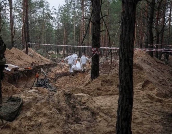 "Shocking Revelation: 450 Ukrainian Victims Found in Mass Graves after Russian Occupation - Torture and Execution Uncovered! #NeverForget #NeverForgive" — Ukrainian massacre, Russian occupation, War crimes discovery