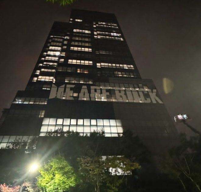HYBE unveils massive BTS banner: Genius marketing or over-the-top idol worship? — HYBE headquarters showcases BTS comeback with stunning banner, K-pop sensation BTS comeback banner unveiled at HYBE headquarters, HYBE building adorned with massive banner for BTS comeback