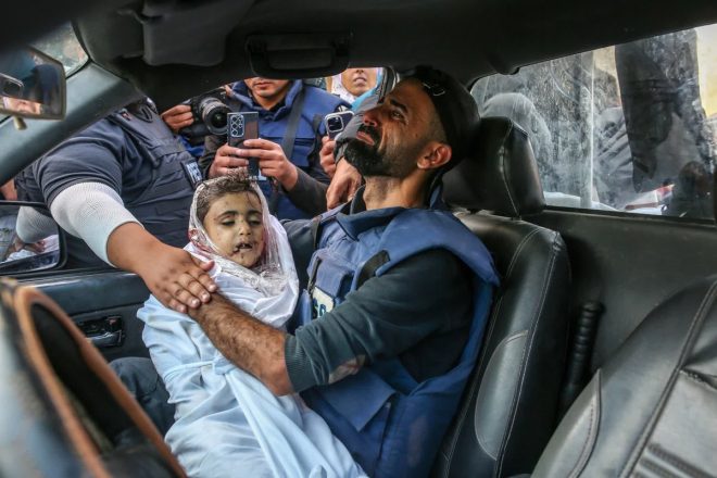 Tragedy Strikes: Photojournalist Loses Child in Gaza Attack — Gaza conflict photography, Palestinian refugee crisis, child victims of war