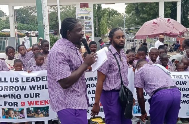 VDM's Bold Protest: Teaching Kids Controversial Politics! — Protest in Abuja over Teachers' Strike, VeryDarkMan Schoolchildren Alphabet Protest 2025, FCT Minister Gate Demonstration