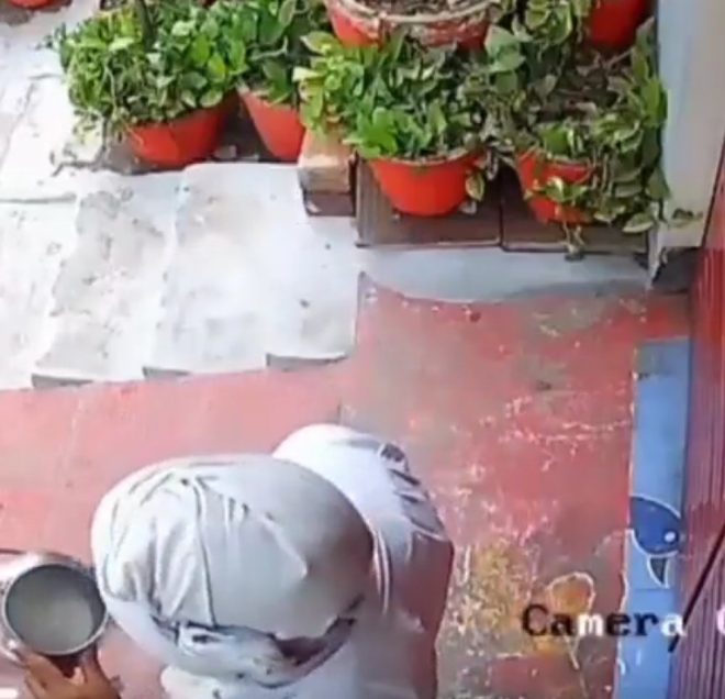 Shocking Video: Milkman Spits in Milk for Hindu Home! 🚨 — CCTV milk contamination incident, religious worship milk scandal, Lucknow milkman controversy 2025