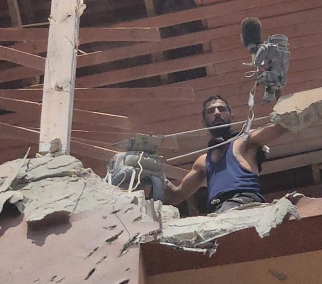 "Shocking Footage: Journalist Discovers Colleague Murdered on Camera at Strike Site - Civil Defense Teams Arrive" —  Tragic loss, Emotional devastation, Heart-wrenching scene