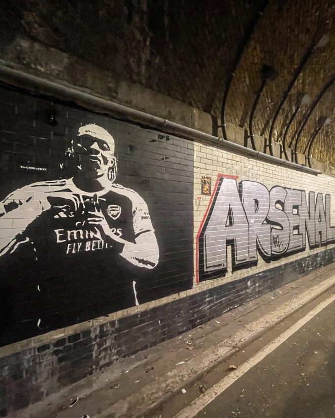 Shocking Mural Emerges: Who's Behind the Emirates Tunnel Art? —  Emirates tunnel mural, Eze street art 2025, North Banksy AFC artwork