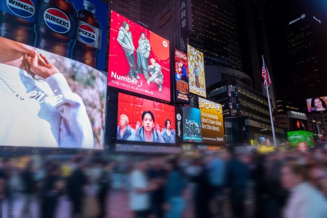 "Controversial New York City Takeover: Number_i Hijacks Times Square Signage with Massive Ad for 'No. Ⅱ' Album Release on Spotify! 📸" —  New York City takeover, Times Square advertising, Spotify album release, visual impact, photo gallery, music promotion, digital marketing, urban branding, street photography, cityscape aesthetics