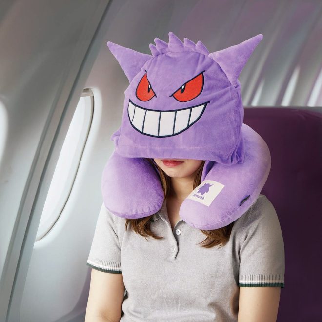 "Controversial new Gengar-inspired travel pillow allows you to sleep in public without anyone noticing - passport cover included!" —  
Travel comfort pillow
Pokemon Gengar merchandise
Sleep mask with hood cover