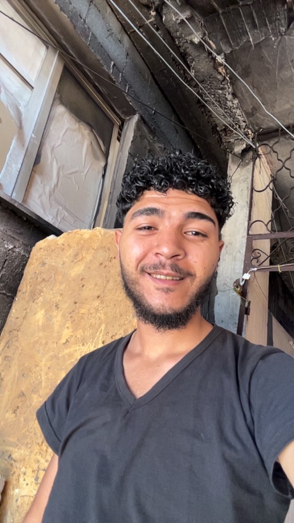 "Man Takes Stand on Gaza Beach: Waiting for Heroes of Humanity to Arrive - Updates from Deir Al-Blah" —  Heroes of humanity, Gaza beach, Deir Al-Blah news