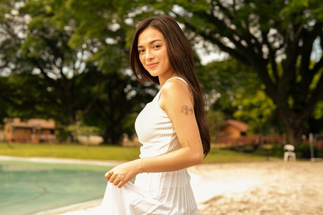"Scandal at the Beach: Mika Salamanca and Brent Manalo's Shocking Duet Video - What If Tayo?" —  Beachside romance, Tropical setting, Sunlit shore