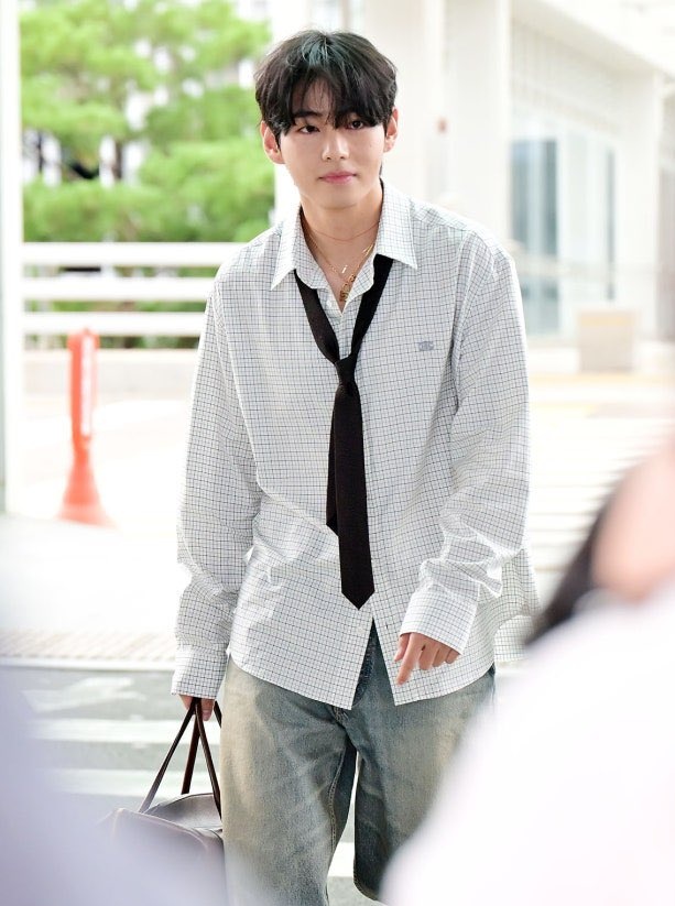 Taehyung Stuns at Airport: Is He the New Fashion Icon? —  Taehyung Paris Fashion Week style, BTS member airport fashion 2025, charming celebrity arrivals